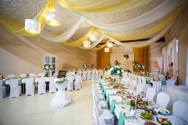 GRODNO BELARUS MAY 2019 View of the served for decorated wedding dinner table in elite restaurant with beautiful flowers