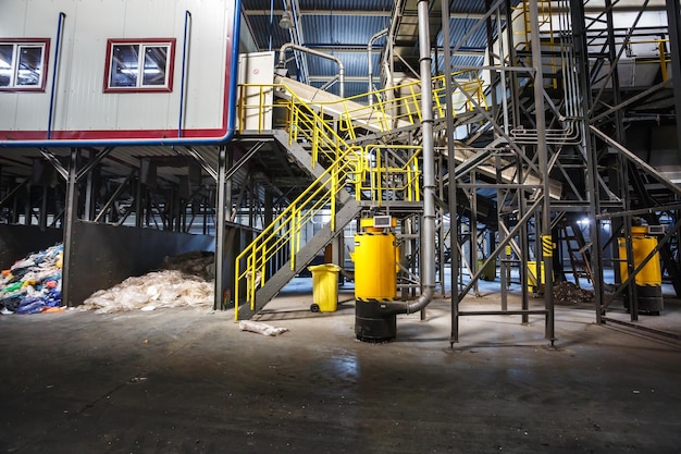 Grodno belarus october 2018 metal constructions of garbage\
sorting conveyor on modern waste recycling processing plant\
separate garbage collection storage of waste for further\
disposal