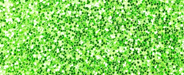 Groene glitter textuur, banner macro foto, hoog gedetailleerd oppervlak. Close-up tot schuurpapier, abstracte glitterlichten voor vakantieviering, nieuwjaar en kerstmis. Gloeiend effect concept foto