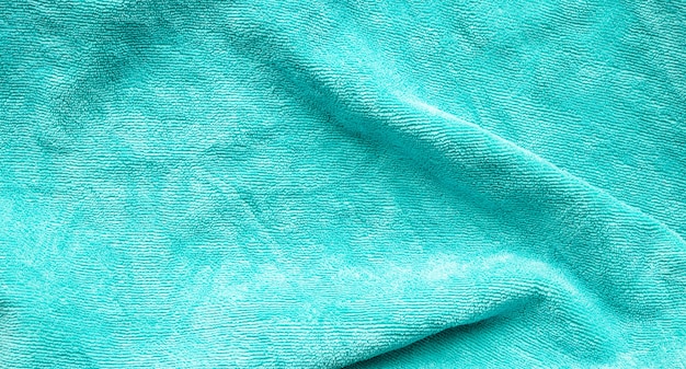 Groene handdoek stof textuur oppervlak close-up achtergrond