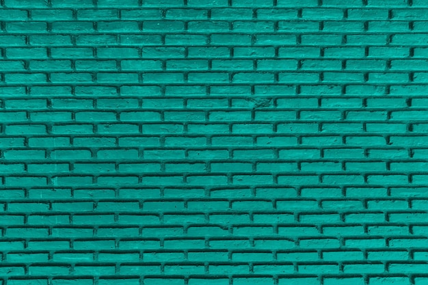 Groene kleur met een oude betontextuur van de grungemuur als achtergrond