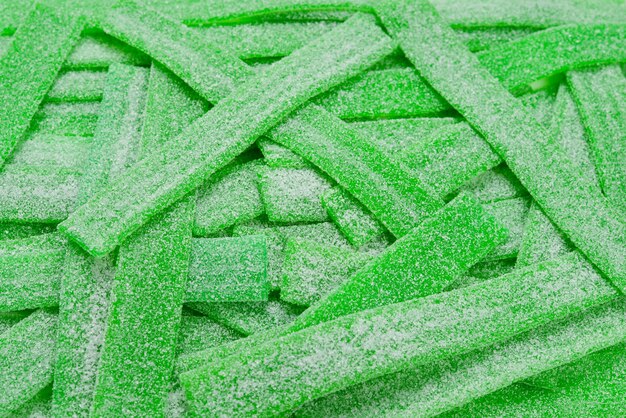 Groene sappige gummy snoepjes achtergrond. Bovenaanzicht. Gelei snoep.