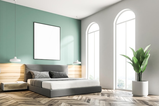 Groene slaapkamerhoek met een houten vloer, een king size bed en een frame verticale poster die er boven hangt. 3d rendering mock up