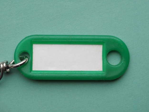 Groene sleutelhanger met wit label