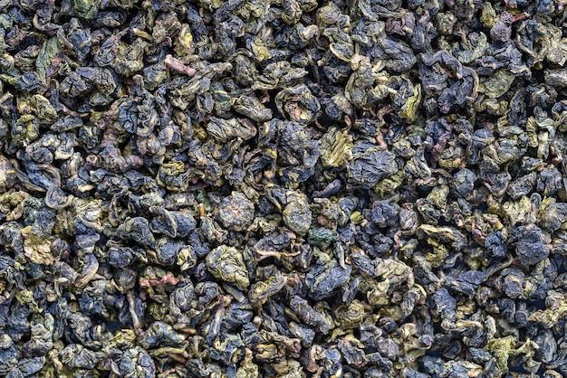 Groene theebladeren achtergrond Oolong thee Abstracte voedselstructuren Close-up De high-end thee van China