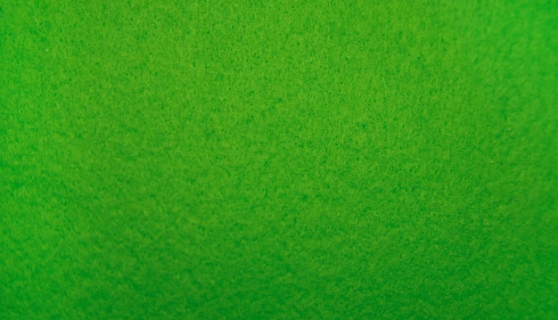 Groene viltstof close-up Abstracte achtergrond De textuur van de vezels Fluwelen oppervlak