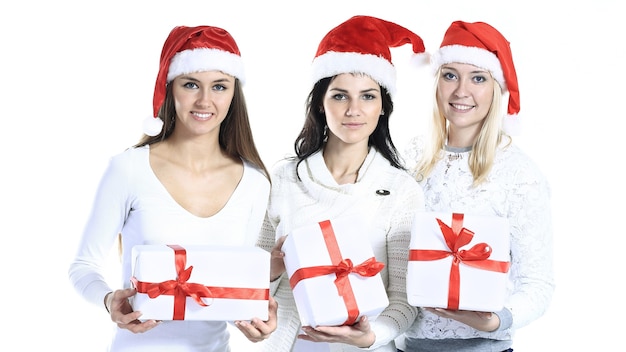 Groep vrouwelijke studenten in kostuum van santahoed met Kerstmisgiften