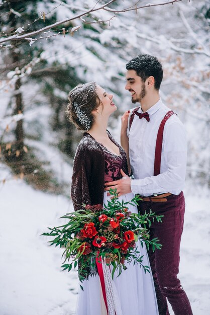 Groom and bride in the mountains Carpathians