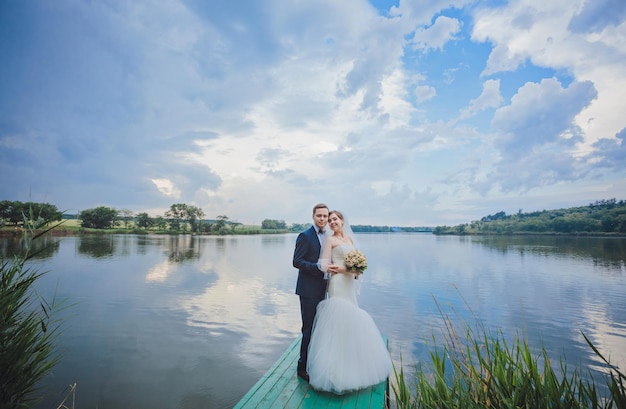 Groom and Bride in a park wedding dress