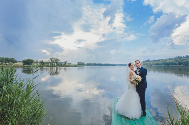 Groom and Bride in a park wedding dress