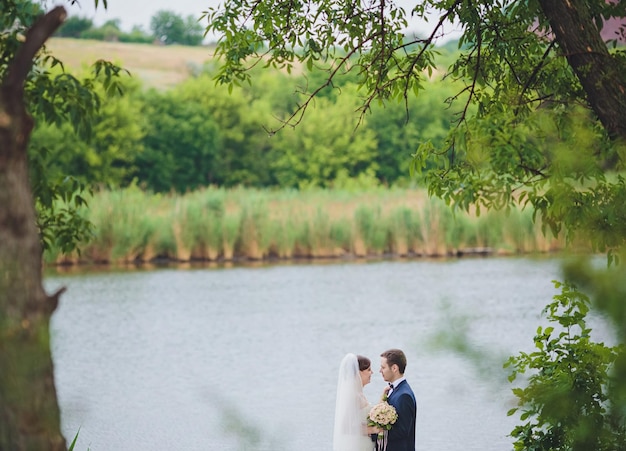 Groom and Bride in a park wedding dress