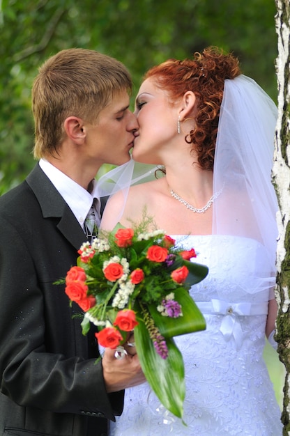 groom and bride portrait kissing