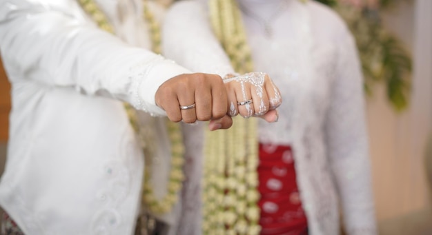 Groom and Bride Showing Wedding Rings