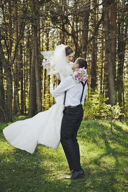 The groom circling the bride in his arms 4077