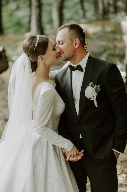 groom gently embracing his bride