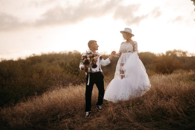 the groom holds the bride by the hand