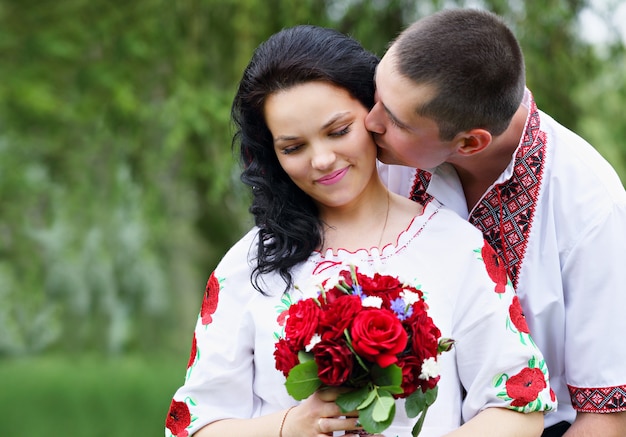 The groom kisses the bride