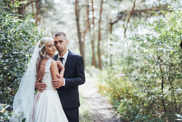 Groom at a park on their wedding day