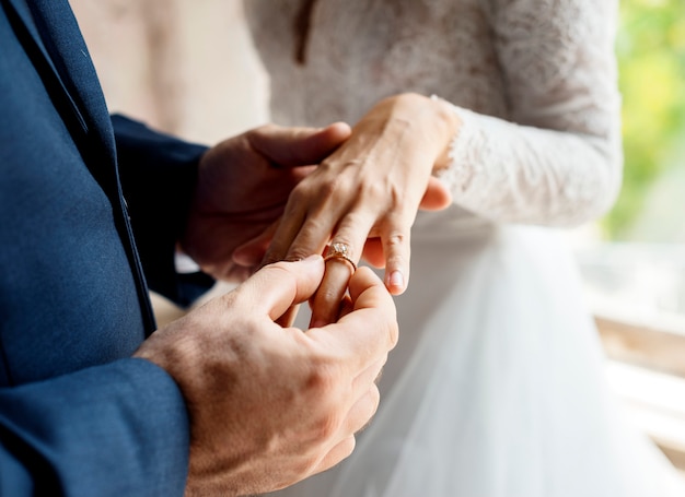 Groom Put on Wedding Ring Bride Hand