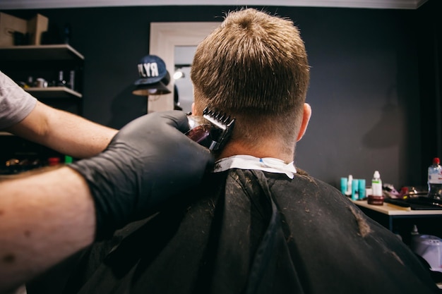 groom's haircut in the barbershop before the wedding, groom's haircut in the barbershop, close-up