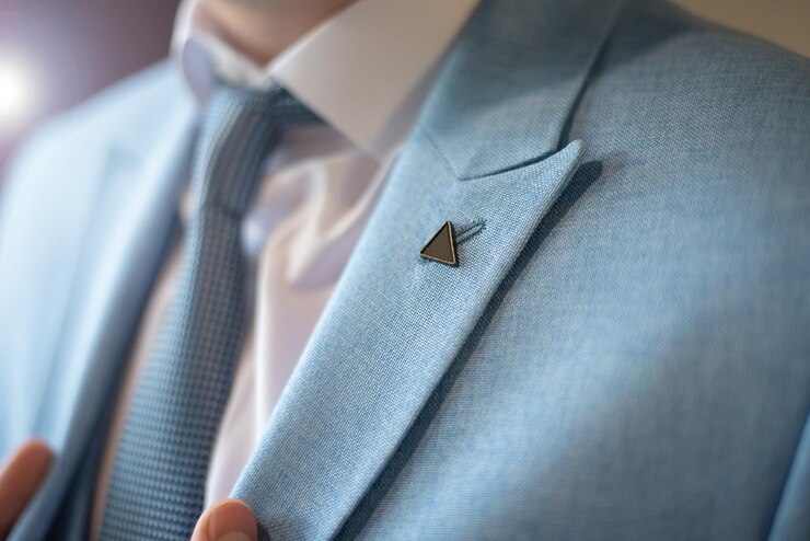 Groom's preparations before the wedding ceremony tie and jacket closeup of hands