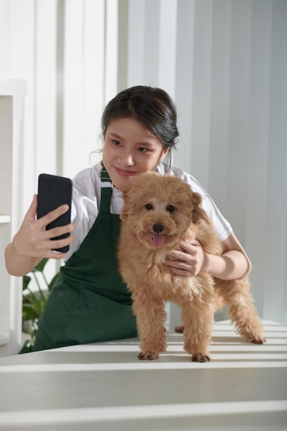 Groomer Taking Selfie with Dog