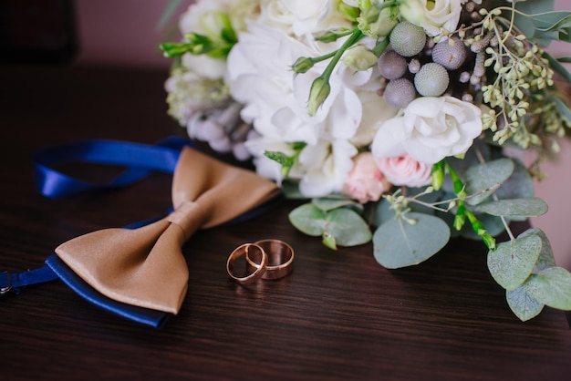 Grooms accessories for preparation on wedding day, shoes, rings and bouquet