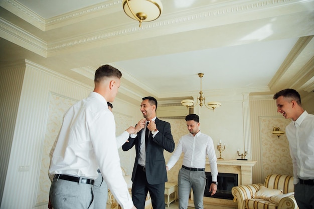 Groomsmen and groom posing on the wedding day.