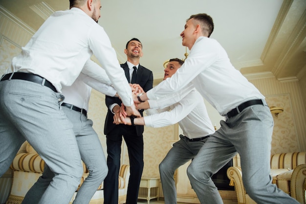 Groomsmen and groom posing on the wedding day.