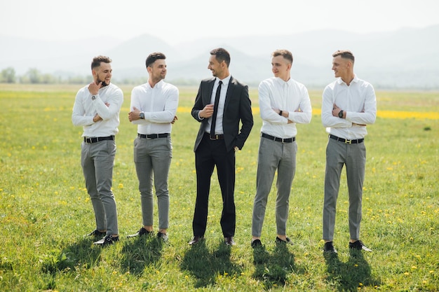 Groomsmen and groom posing on the wedding day.