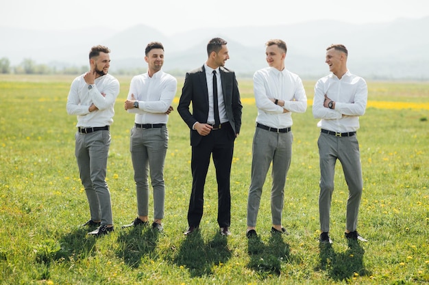 Groomsmen and groom posing on the wedding day.