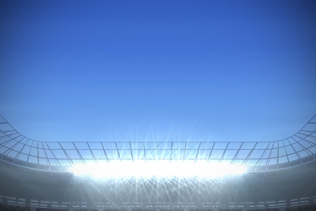 Groot voetbalstadion onder heldere blauwe hemel