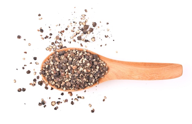 Ground black pepper isolated on a white background Top view