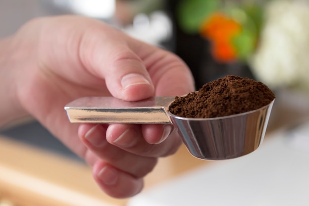 Ground coffee in a spoon