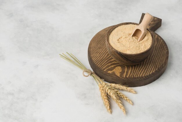 Photo ground grain on wood plate composition on white background