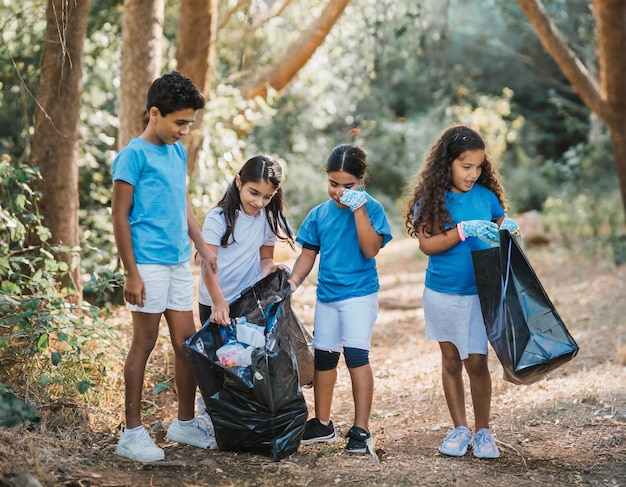 group of 12 year old boys and girls collecting abandoned garbage in the mountainsn