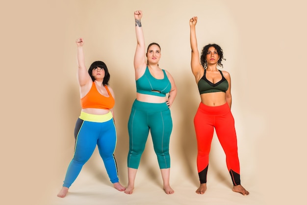 Group of 3 oversize women posing. Body acceptance and body positivity