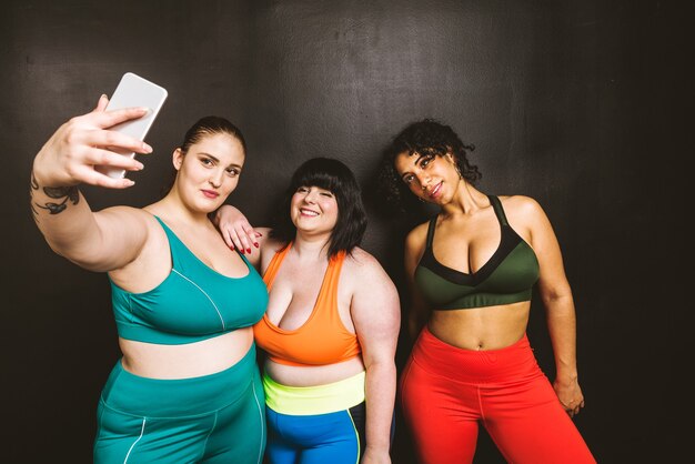 Group of 3 oversize women posing. Body acceptance and body positivity