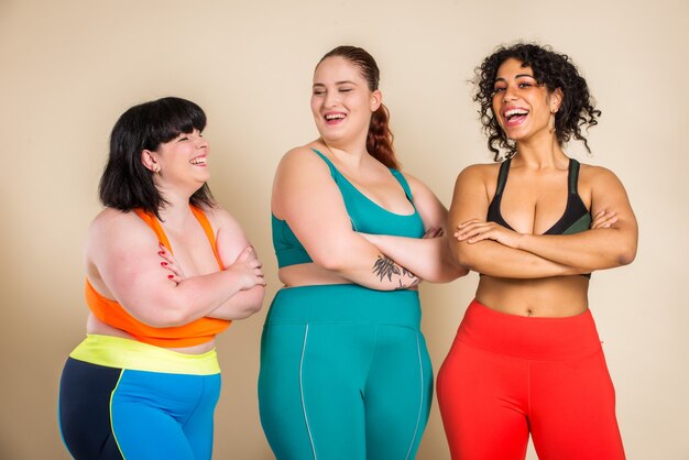 Group of 3 oversize women posing. Body acceptance and body positivity