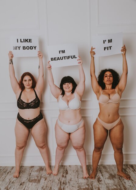 Group of 3 oversize women posing in studio