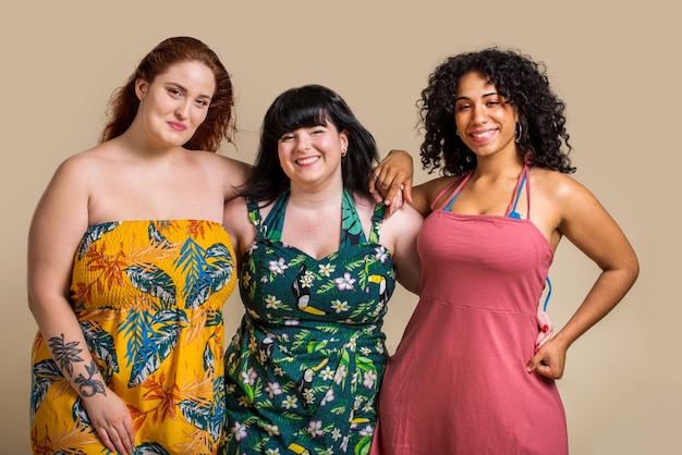 Group of 3 oversize women posing in studio