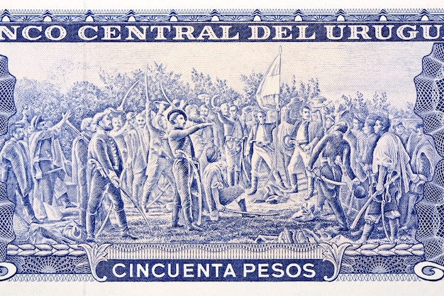 ウルグアイのお金ペソスからの旗を持つ33人の男性のグループ