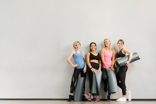 Group of adult women posing at the gym