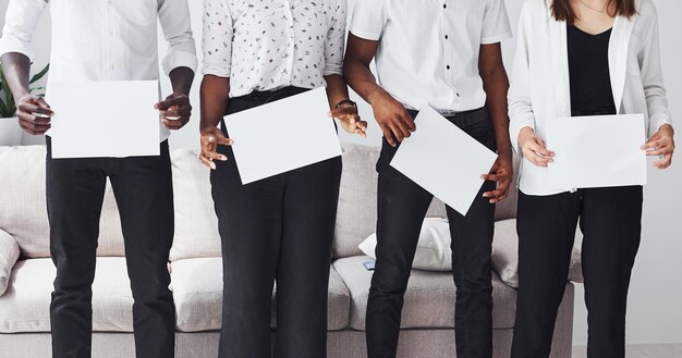 Group of african american business people near sofa in office together