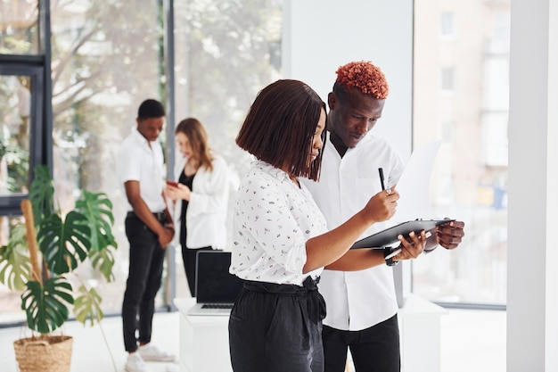 Group of african american business people working in office together