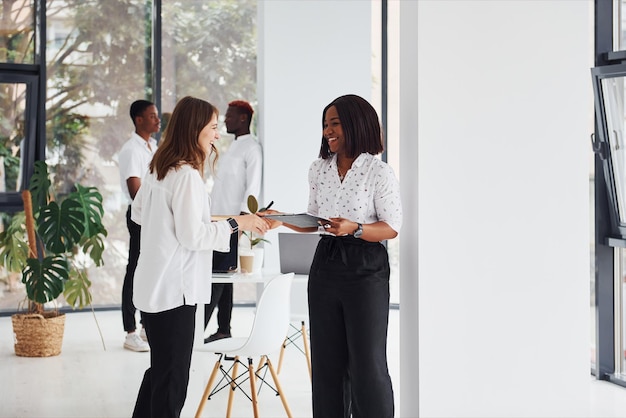 Group of african american business people working in office together