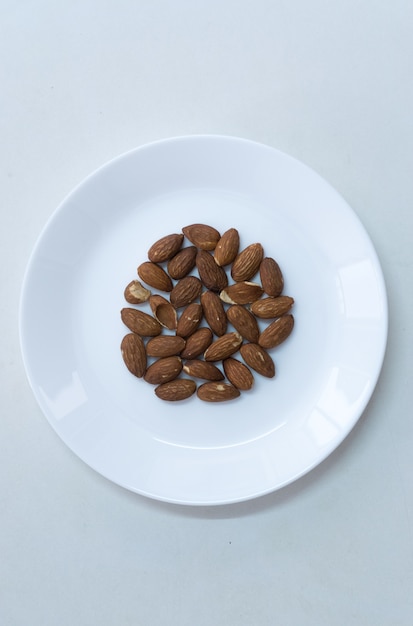 Group Almond on white dish top view