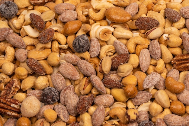 A group of almonds pistachios walnuts macadamia cashews