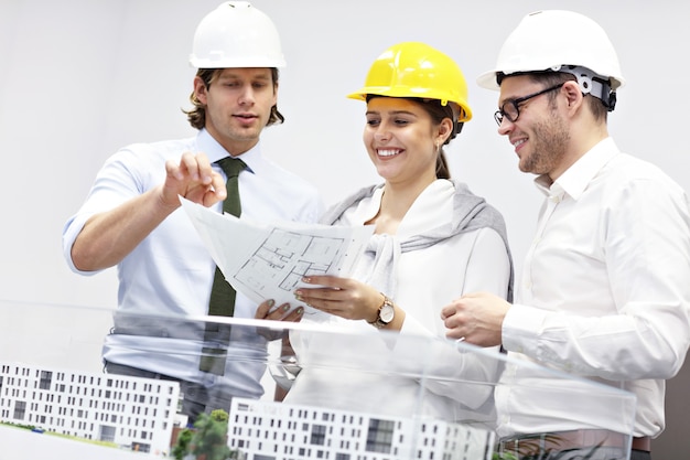 Group of architects sharing ideas in modern office