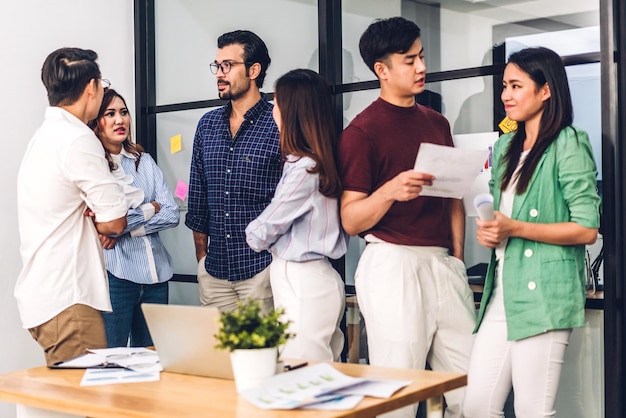 Group of asian business meeting and discussing strategy startup project analysis finance process.Success business people plan and brainstorm marketing idea with document in office.Teamwork